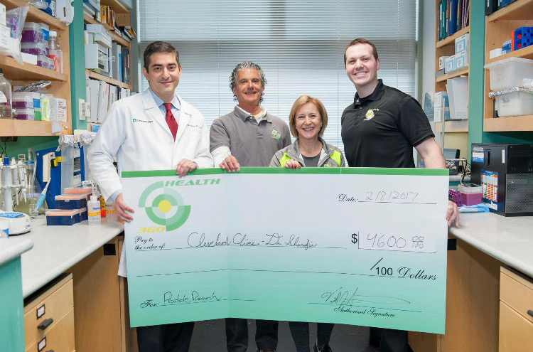 Health 360 team making charitable donation